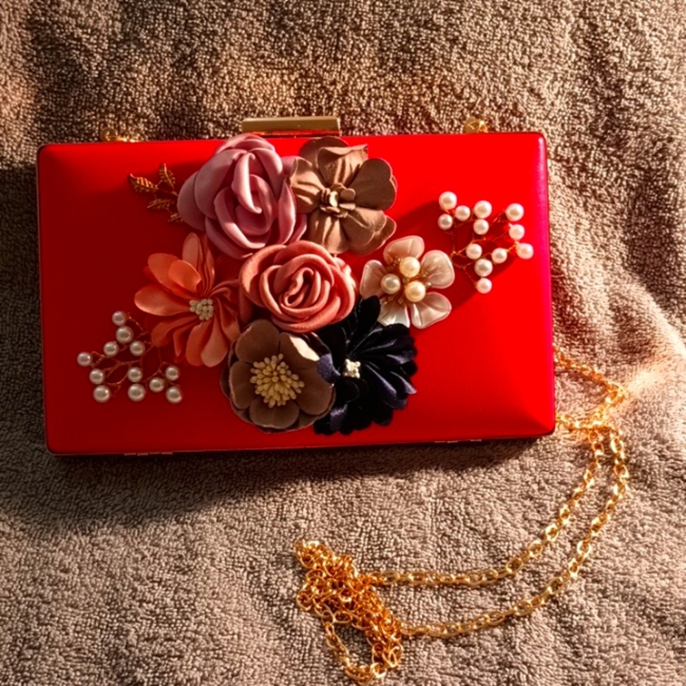 Red clutch with flowers and pearls
